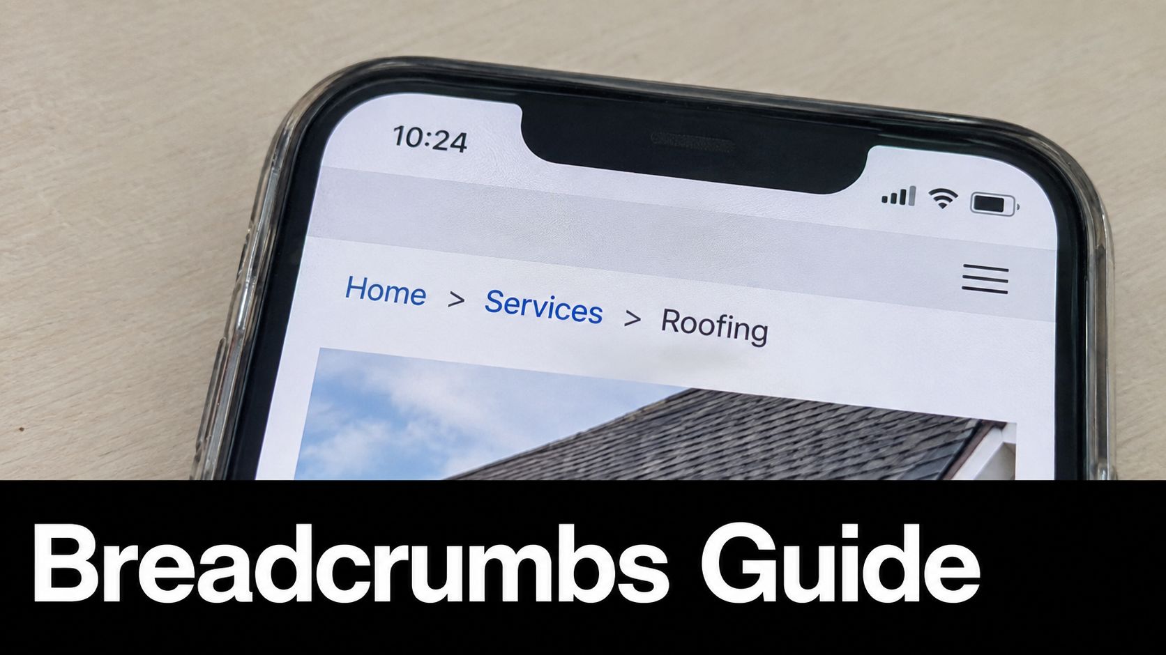 A close up view of a smartphone screen showing website breadcrumb navigation links for a roofing service.