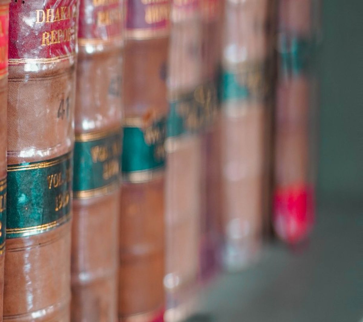 Row of leather bound law report volumes on a shelf